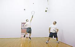 Guys playing racquetball